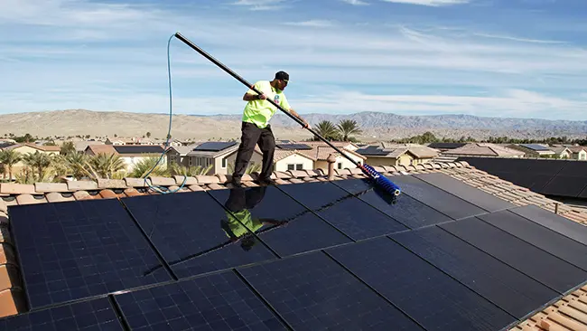 professional-solar-panel-cleaning-service-riverside-california-grime-reapers-on-roof-cleaning-with-brush-attachment